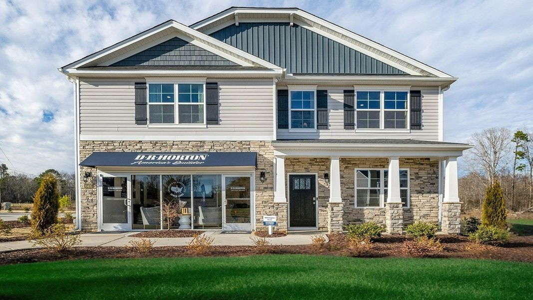Front exterior of a home in the The Reserve at Stoney Creek community, located in Whitsett, NC (Image 1).