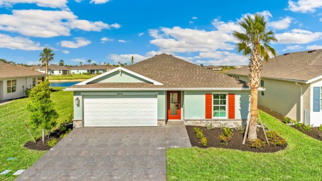 Front exterior of a home in the Palmetto Landing at Babcock Ranch Express community, located in Punta Gorda, FL (Image 4).