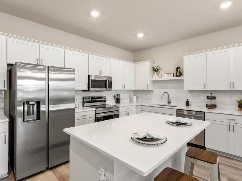 Available design packages offer timeless white finishes - Flora townhome by Highland Homes