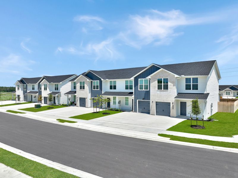 Front exterior of a home in the Townhomes at Yaupon Trails community, located in Bryan, TX (Image 7).