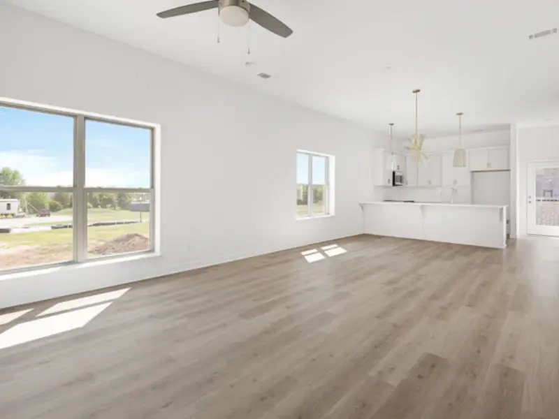 The open-concept floorplan allows for an easy flow between the kitchen and living areas.