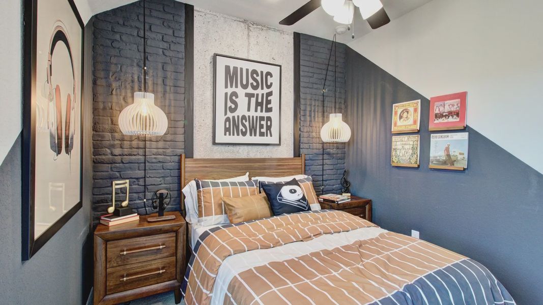 Experience refined elegance with pendant lighting and bold accent wall in Sunflower Ridge.