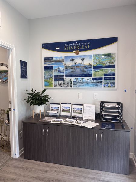 A sleek office with a display promoting SilverLeaf amenities, brochures, and modern cabinetry. A sleek office with a display promoting SilverLeaf amenities, brochures, and modern cabinetry.