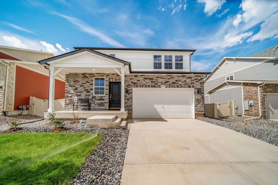 Front exterior of a home in the Brio Collection at Thompson River Ranch community, located in Johnstown, CO (Image 1). Front exterior of a home in the Brio Collection at Thompson River Ranch community, located in Johnstown, CO (Image 1).