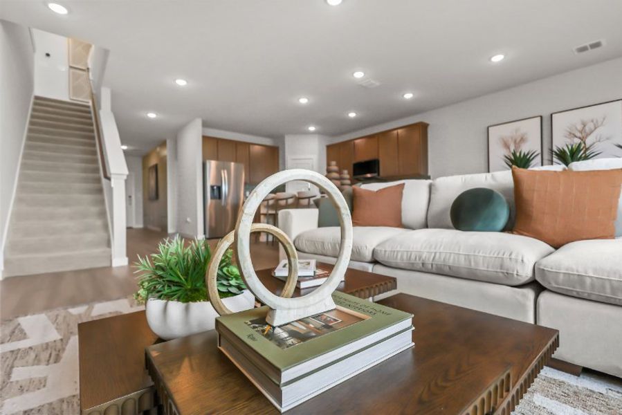 A living room with a couch and a table. A living room with a couch and a table.