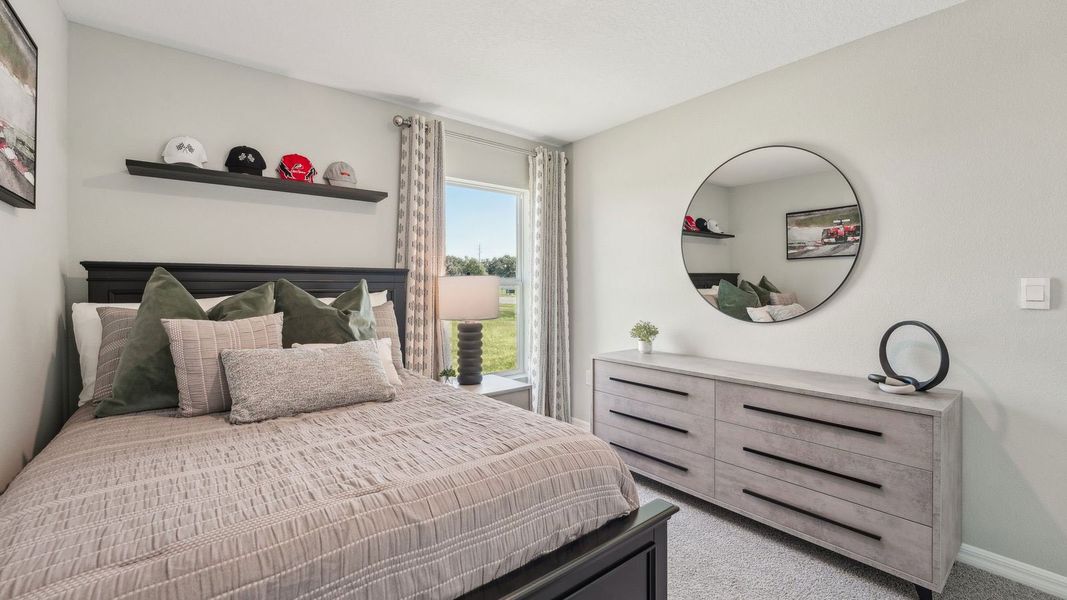 Furnished interior in a model home at Sunset Hills in Summerfield (Image 26).