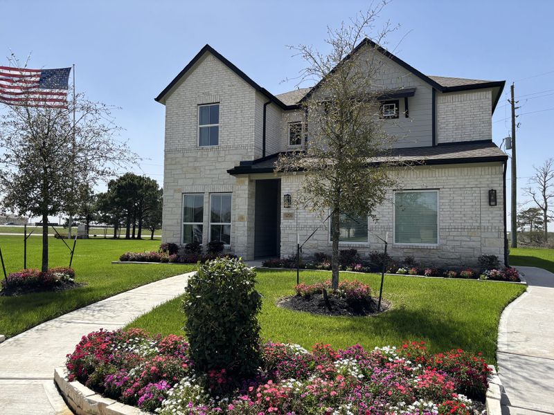 A charming stone home with lush landscaping in Edgewood Village by Long Lake Ltd. (Houston, TX). A charming stone home with lush landscaping in Edgewood Village by Long Lake Ltd. (Houston, TX).