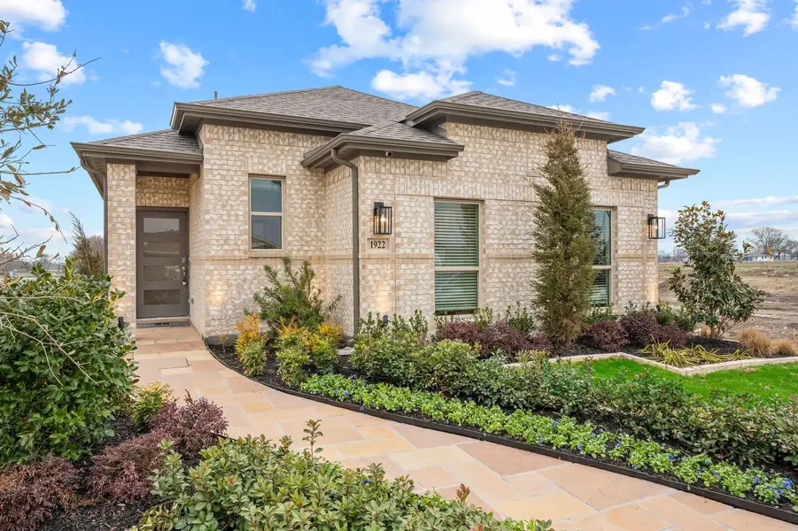 Front exterior of a home in the Creekside Ranch community, located in Blue Ridge, TX (Image 2).