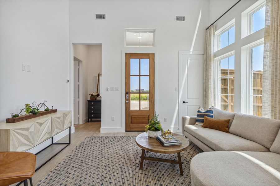 Furnished interior in a model home at Newman Village Townhomes in Frisco (Image 19).
