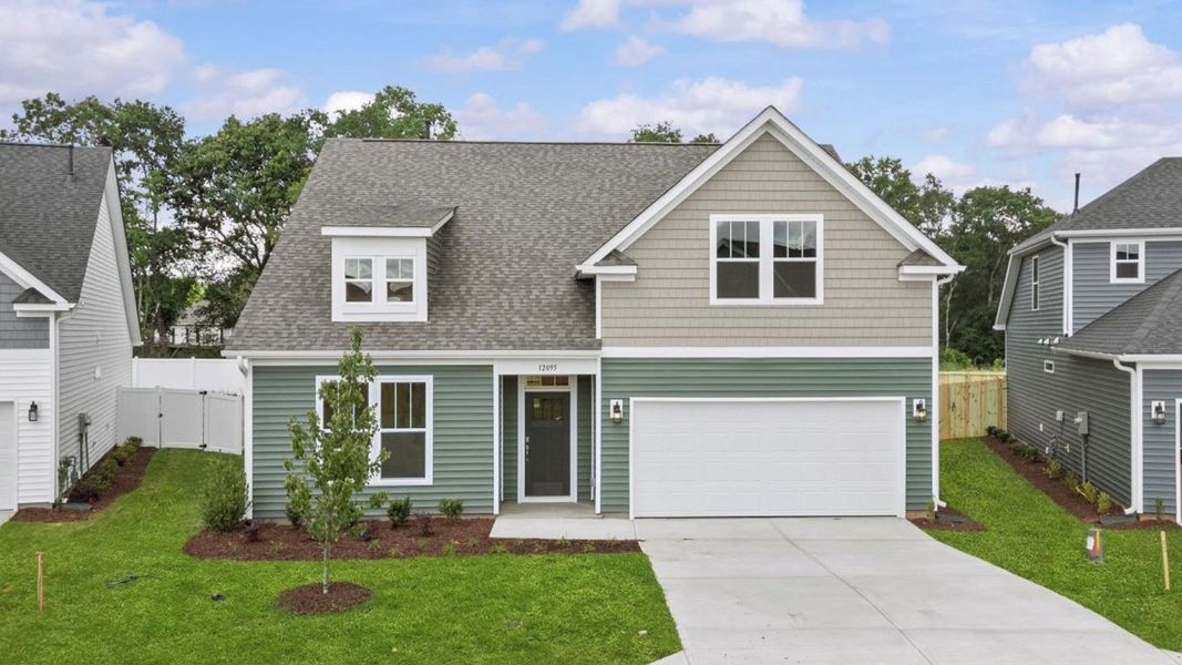 DRB Homes' Walnut Ridge community featuring the Cooper 3 in a stunning bright white exterior with stone detailed columns