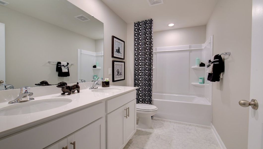 Furnished interior in a model home at Rydele Heights in Weaverville (Image 9).