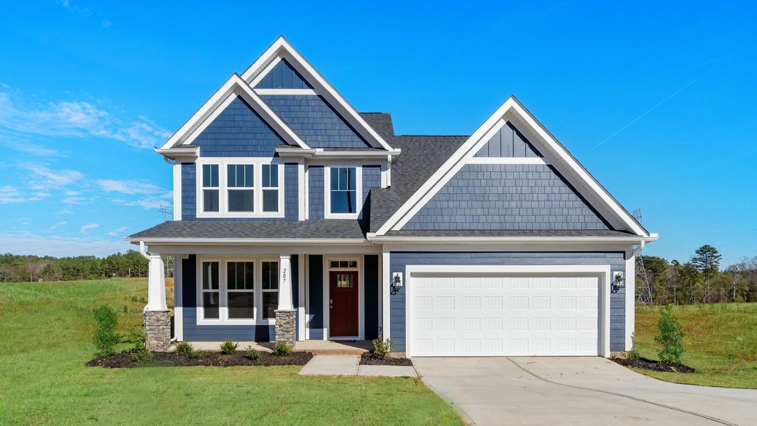 Front exterior of a home in the The Wilds at Cedar Mountain community, located in Asheville, NC (Image 19). Front exterior of a home in the The Wilds at Cedar Mountain community, located in Asheville, NC (Image 19).