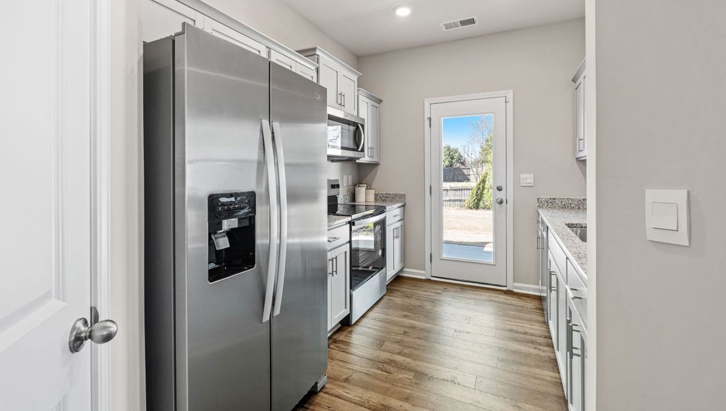 Furnished interior in a model home at Covington Village in Greer (Image 8).