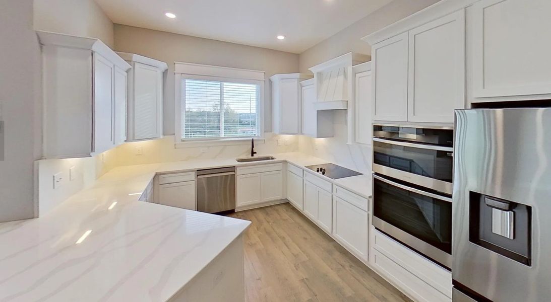 Luxury Kitchens hosting microwave oven and oven, decorative hood vent, included French door refrigerator, quartz countertops Luxury Kitchens hosting microwave oven and oven, decorative hood vent, included French door refrigerator, quartz countertops