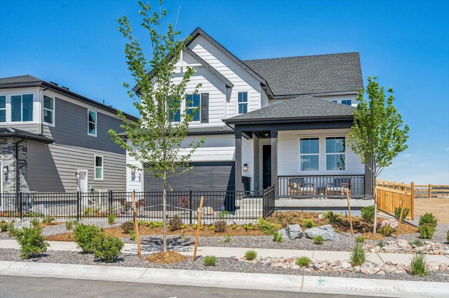 A house with a fence around it. A house with a fence around it.