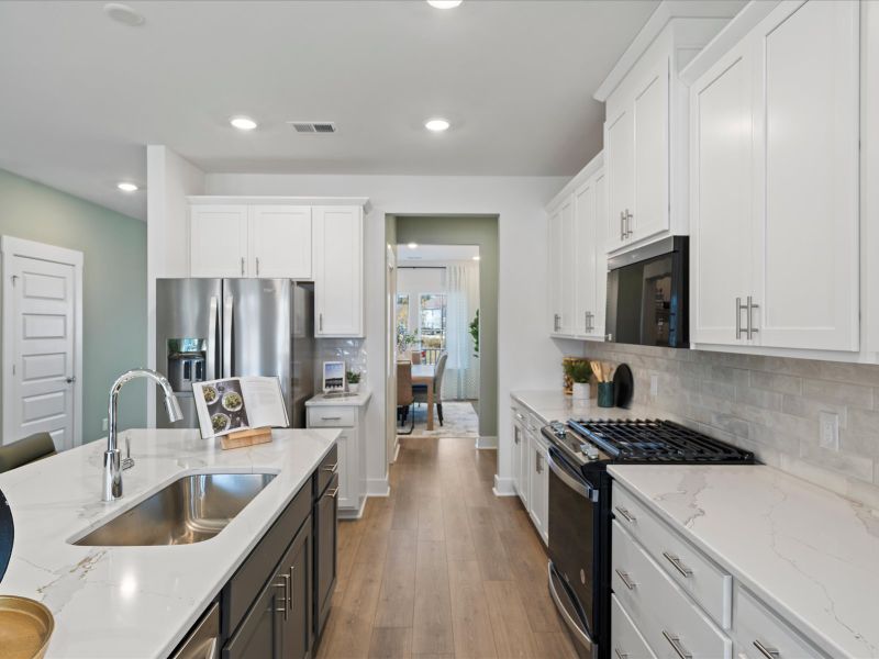Designer curated finishes and plenty of counter space to meal prep.