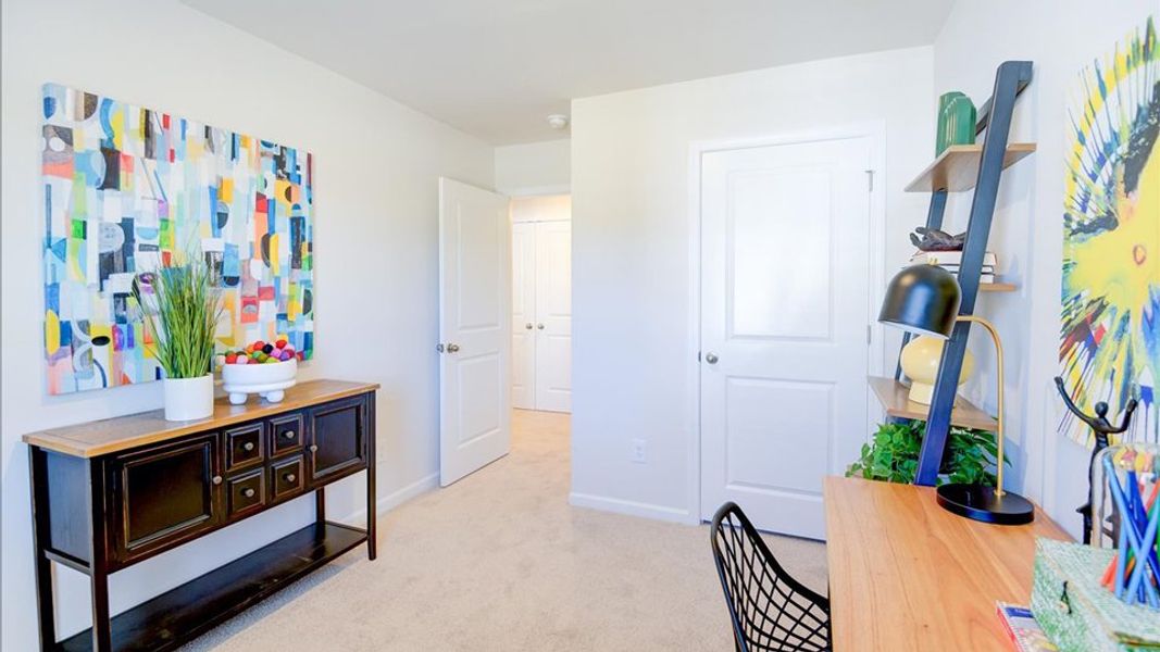 Furnished interior in a model home at Edinborough Townes in Gibsonville (Image 6).
