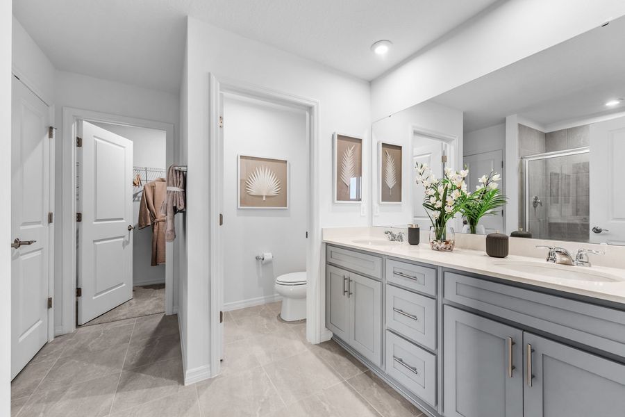 Primary Bathroom with Double Sink and Walk-In Closet Primary Bathroom with Double Sink and Walk-In Closet