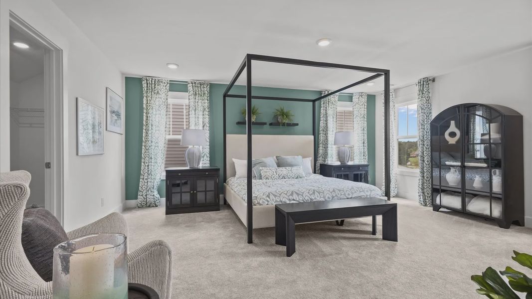 Cozy, relaxing primary suite with plush carpet and large windows to let the light in at Woodglen in Piedmont, SC