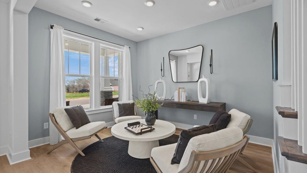 New two story home in Woodruff, SC with den with large windows and hardwood flooring at Pinebrook New two story home in Woodruff, SC with den with large windows and hardwood flooring at Pinebrook