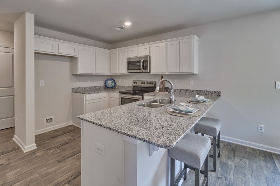 Furnished interior in a model home at Hunters Branch in Hopkins (Image 5).