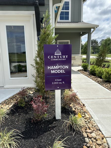 Charming exterior of the Hampton model in Northpark South by Century Communities, featuring lush landscaping (Porter, TX).
