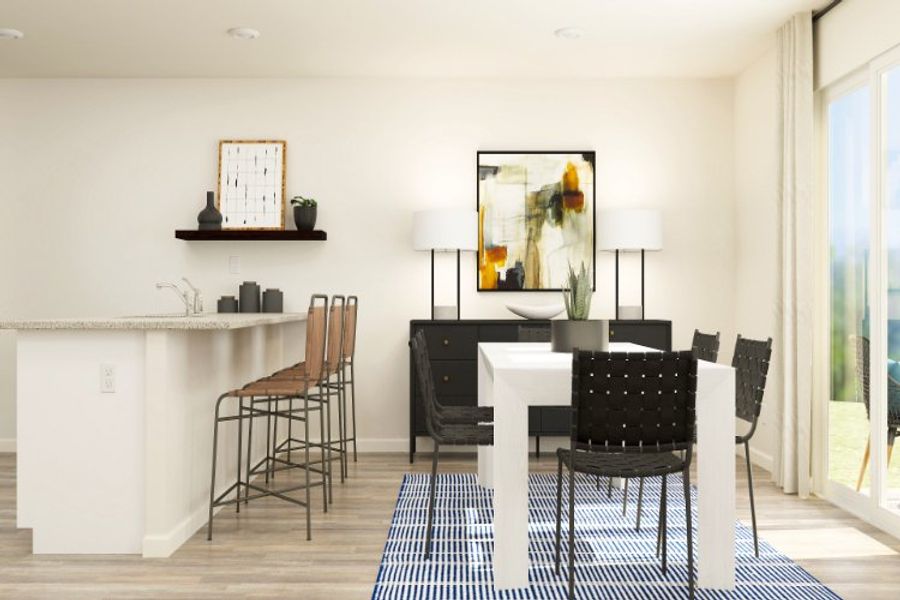 A dining room with a table and chairs.