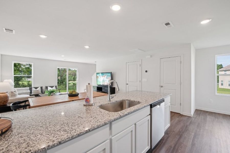 A kitchen with white cabinets. A kitchen with white cabinets.