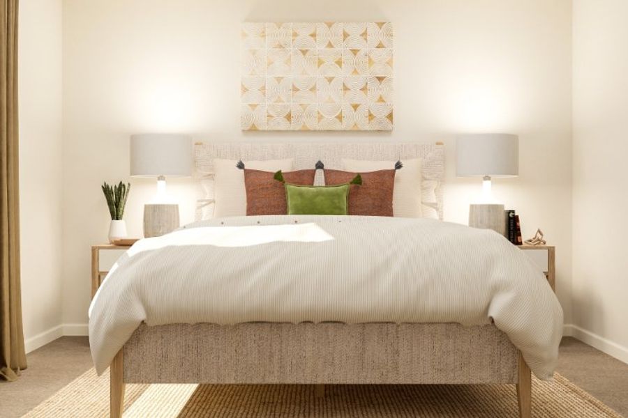 A bed with a white bed spread. A bed with a white bed spread.