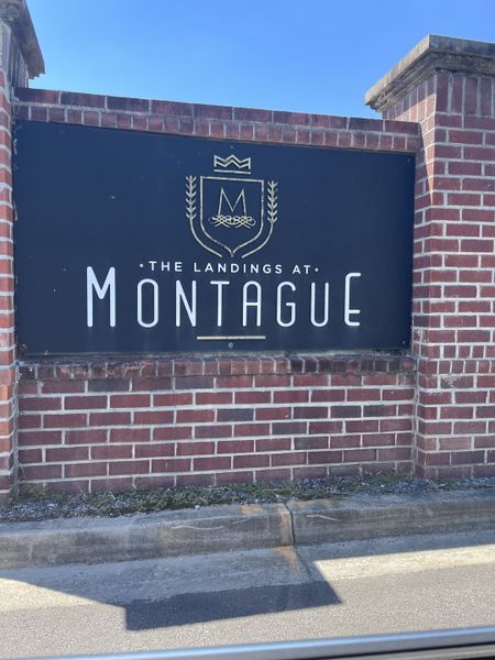 Entrance sign for The Landings at Montague by Eastwood Homes in Goose Creek, SC, featuring elegant brickwork and classy design.