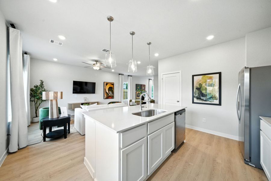 A kitchen with white cabinets. A kitchen with white cabinets.