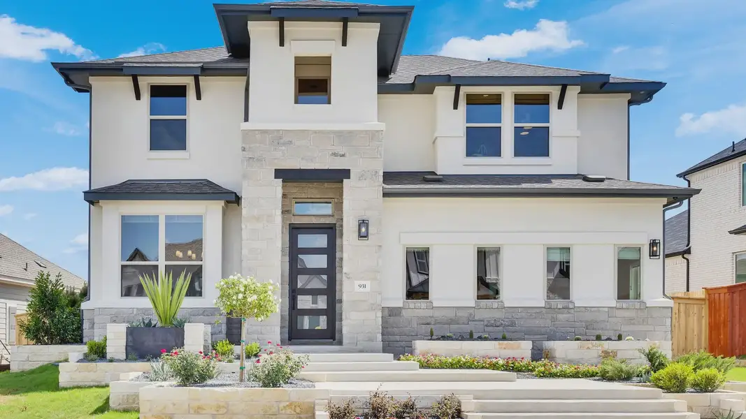 Exquisite stone façade and expansive windows define this stunning Sunfield community residence. Exquisite stone façade and expansive windows define this stunning Sunfield community residence.
