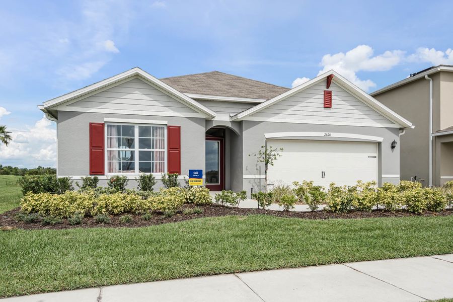 Front exterior of a home in the Lakes at Laurel Highlands community, located in Lakeland, FL (Image 1).