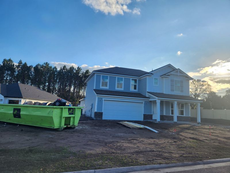 A modern blue two-story home under construction in Edinburgh Village by Drees Custom Homes (Jacksonville, FL).
