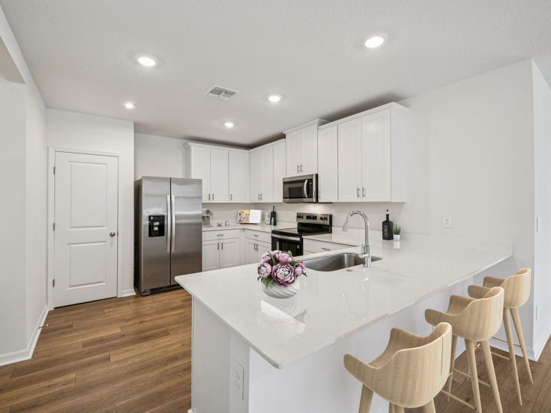 Furnished interior in a model home at Ridgehaven - Villas in Ormond Beach (Image 5).