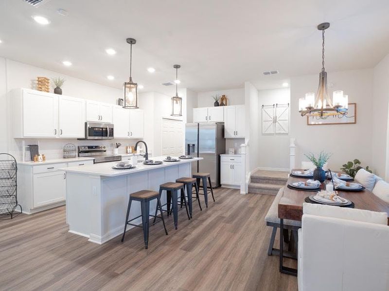 Your new home wows with a well-appointed kitchen with an island, pantry, and Samsung appliances - Aria model home in St. Cloud, FL Your new home wows with a well-appointed kitchen with an island, pantry, and Samsung appliances - Aria model home in St. Cloud, FL