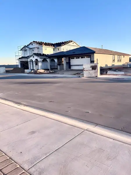 A contemporary two-story home under construction in Hawes Crossing Discovery Collection by Taylor Morrison (Mesa, AZ). A contemporary two-story home under construction in Hawes Crossing Discovery Collection by Taylor Morrison (Mesa, AZ).