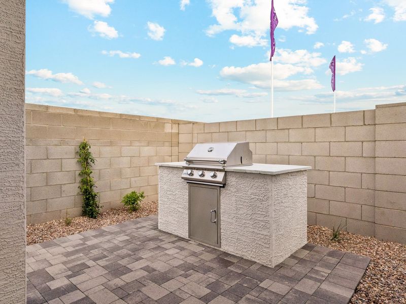 A concrete wall with a door and a flag on it.