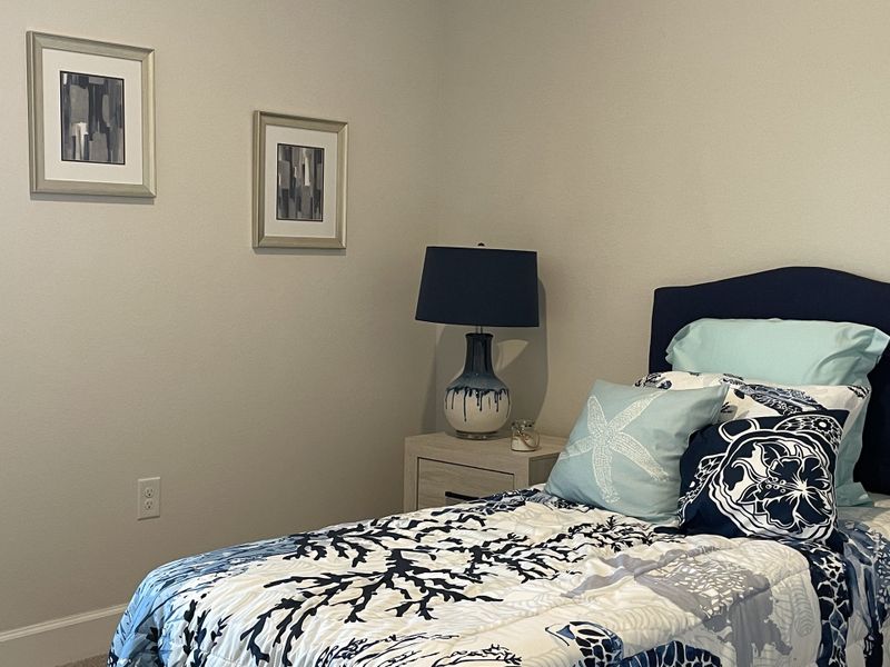 Furnished interior in a model home at Watercress Cove in North Port (Image 6).