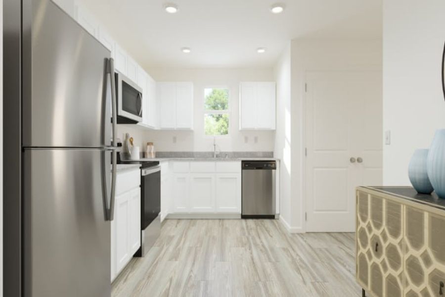 A kitchen with white cabinets. A kitchen with white cabinets.