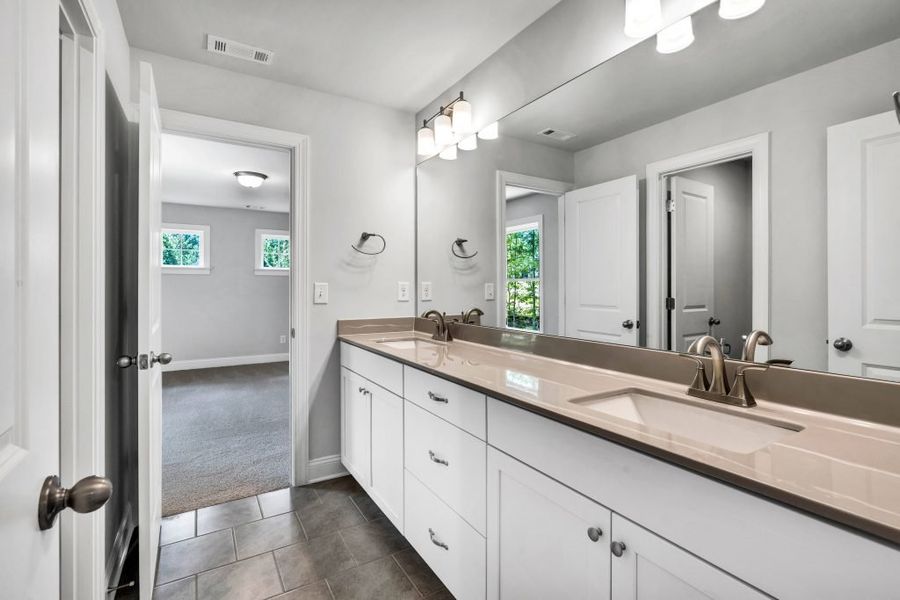 Furnished interior in a model home at The Estates at Hurricane Pointe in Douglasville (Image 43).