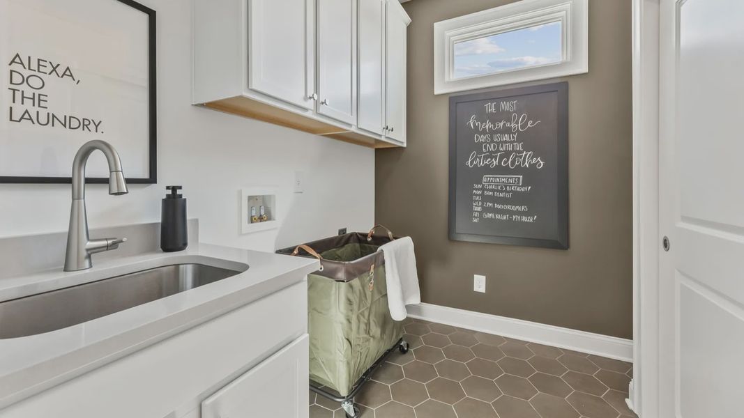 Furnished interior in a model home at The Courtyards at Post Road in Cumming (Image 17).