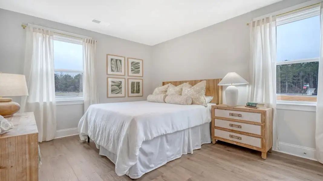 Furnished interior in a model home at Wappetaw Woods in Awendaw (Image 7).