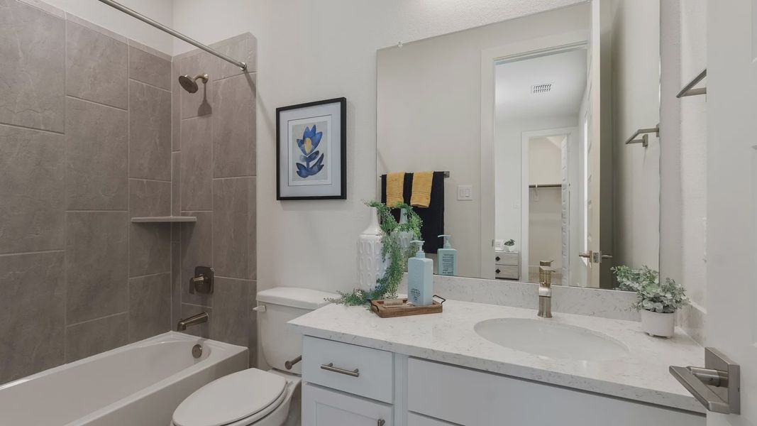 Furnished interior in a model home at Shady Acres in Houston (Image 17).