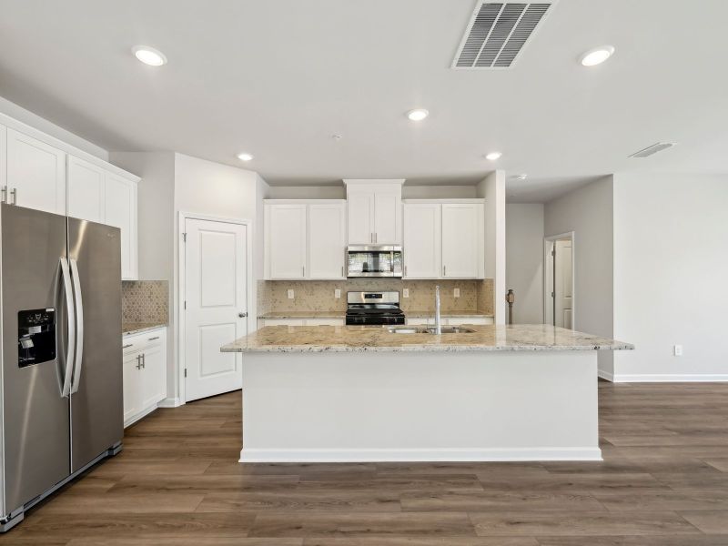Furnished interior in a model home at Brooks Lake in Loganville (Image 5).