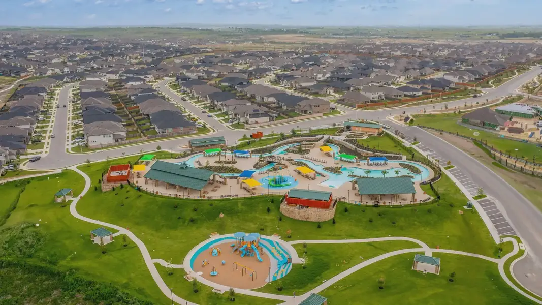 Aerial view of the Sunfield community in Buda, TX, showing layout and nearby surroundings (Image 1). Aerial view of the Sunfield community in Buda, TX, showing layout and nearby surroundings (Image 1).