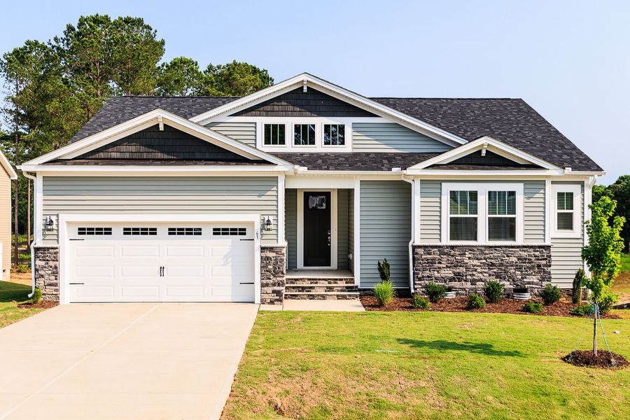 Front exterior of a home in the Seagrass Landing community, located in Lillington, NC (Image 1). Front exterior of a home in the Seagrass Landing community, located in Lillington, NC (Image 1).