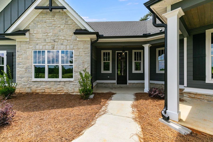 Front exterior of a home in the The Meadows at Lake Circle community, located in Buchanan, GA (Image 11).