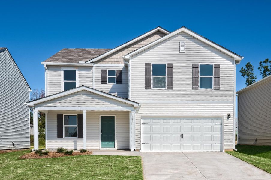 A white house with a garage. A white house with a garage.