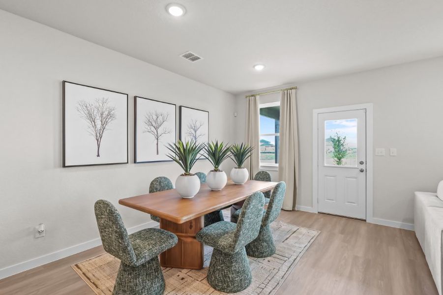 A room with a table and chairs. A room with a table and chairs.